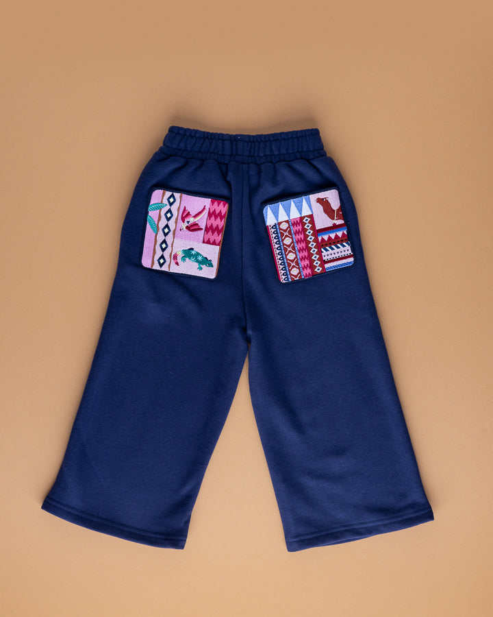 Track pants with embroidered pockets